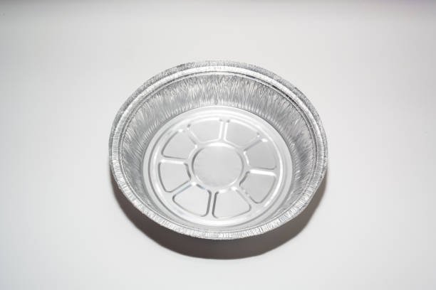 Empty disposable round aluminium food foil container isolated on a white background